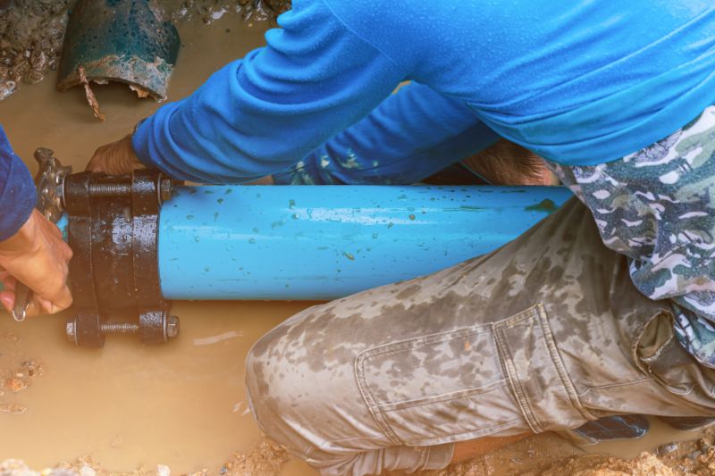 Plumber fixing a water line